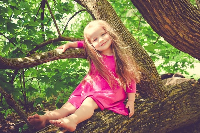 girl smiling in tree